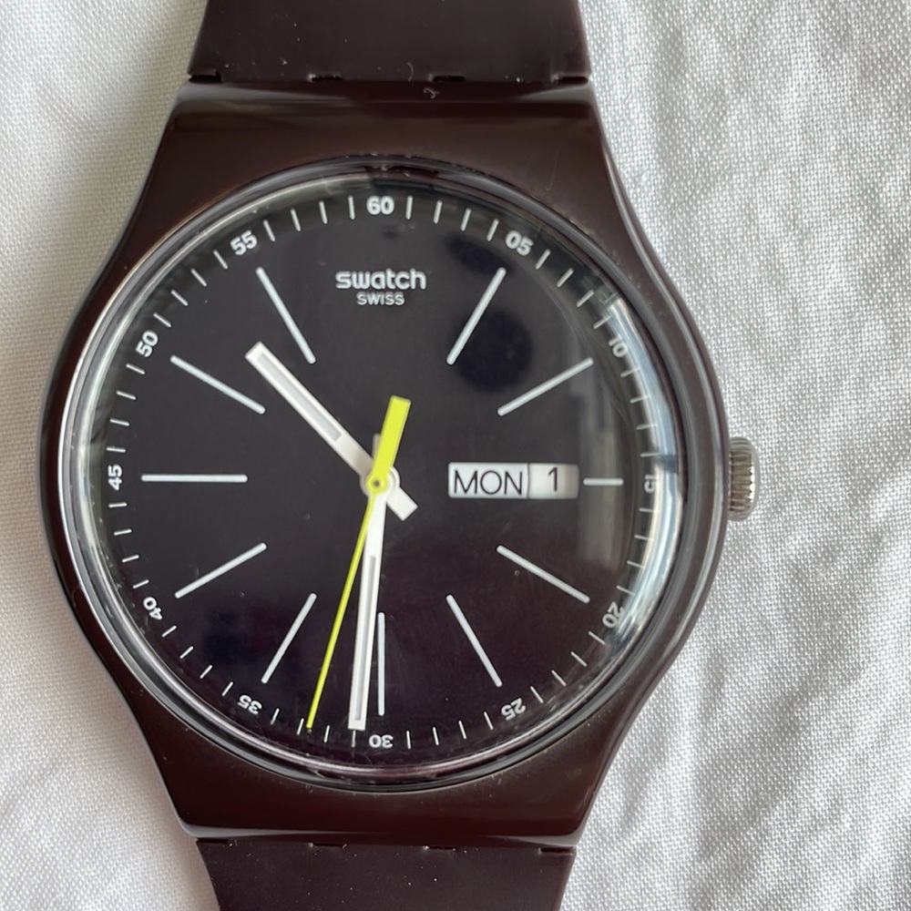 Swatch. Dark brown with day and date.